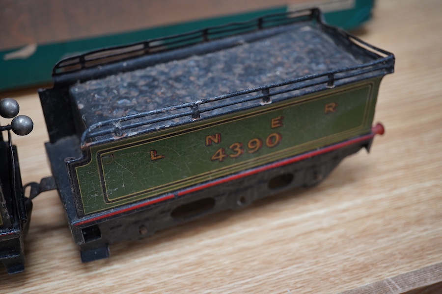 A Bing for Bassett Lowke 0 gauge tinplate clockwork LNER Ivatt 4-4-0 tender locomotive, 4390, together with an early Hornby clockwork 0-4-0, 2710, in GNR green livery with Meccano Ltd roundels to locomotive splasher and